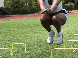 athlete performing vertical jumping exercises