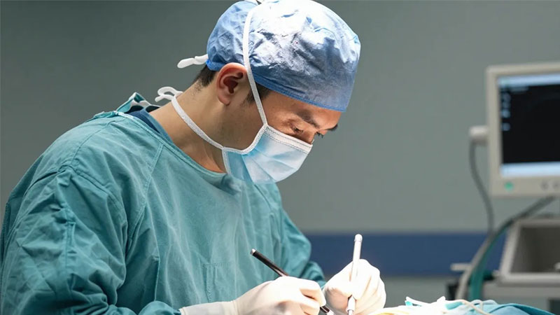 Surgeon performing Spine Surgery