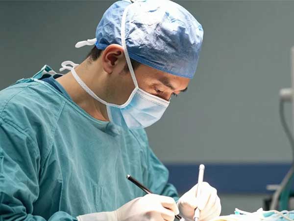 Surgeon performing Spine Surgery